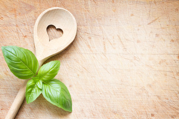 Love cooking background concept with old retro spoon with heart sign
