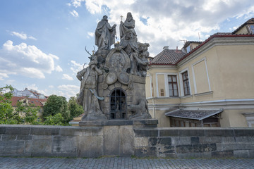Fototapeta na wymiar Czech, Prague, gothic sculpture of the Cyril and Methodius on the Charles bridge. Prague