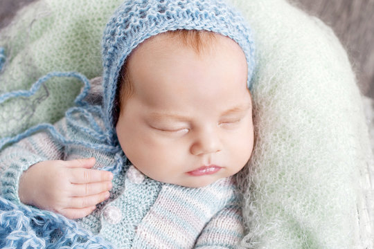 Portrait of sleeping newborn baby boy.  Close up image