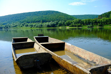 Obraz premium wooden boats on the river