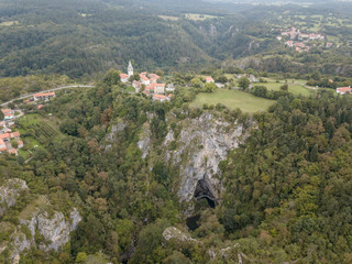 The Skocjan Caves / Skocjanske jame / Grotte di Skocjan is the largest cave in Europe on UNESCO list. The enterance is a huge collapse sinhole / doline below the church of St. Canzian (Kancijan) 