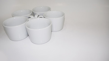 White Ceramic cups or mugs on white back ground.