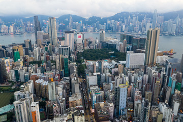 Aerial view of Hong Kong skyline with sun flare