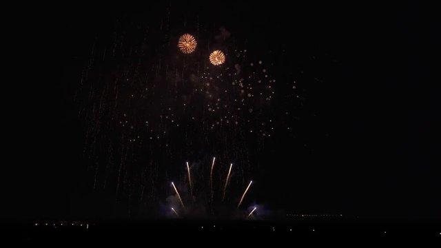 Colorful fireworks on black sky background stock footage video