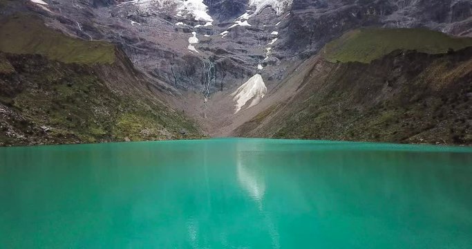 Humantay lake in Peru on Salcantay mountain in the Andes at 5473m altitude, aerial video