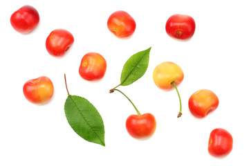 red and yellow cherry with green leaf isolated on white background. Top view