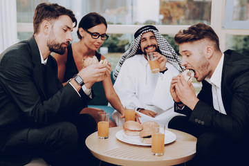 Arab Businessman Is Having Dinner With Partners.