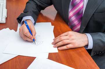 Businessman signs documents