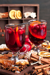 Mulled wine with slice of orange and spices