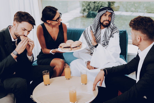 Arab Businessman Is Having Dinner With Partners.