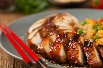Grilled chicken breast in teriyaki sauce. Served with brown rice and vegetables.