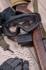 airsoft gun with protective glasses and lot of bullets