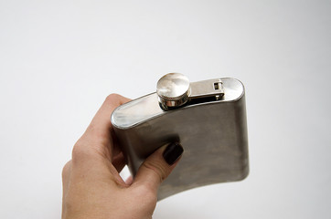 iron flask under a liquor on a white background