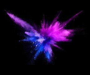 Explosion of coloured powder isolated on black background.