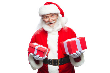 Christmas. Smiling Santa Claus in white gloves holds two boxes with gifts. The concept of choosing a gift, generous gifts. Isolated on white background.