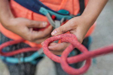A climber knits a knot.