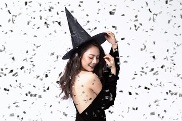  Beautiful young women in black witch halloween costumes on party over white background