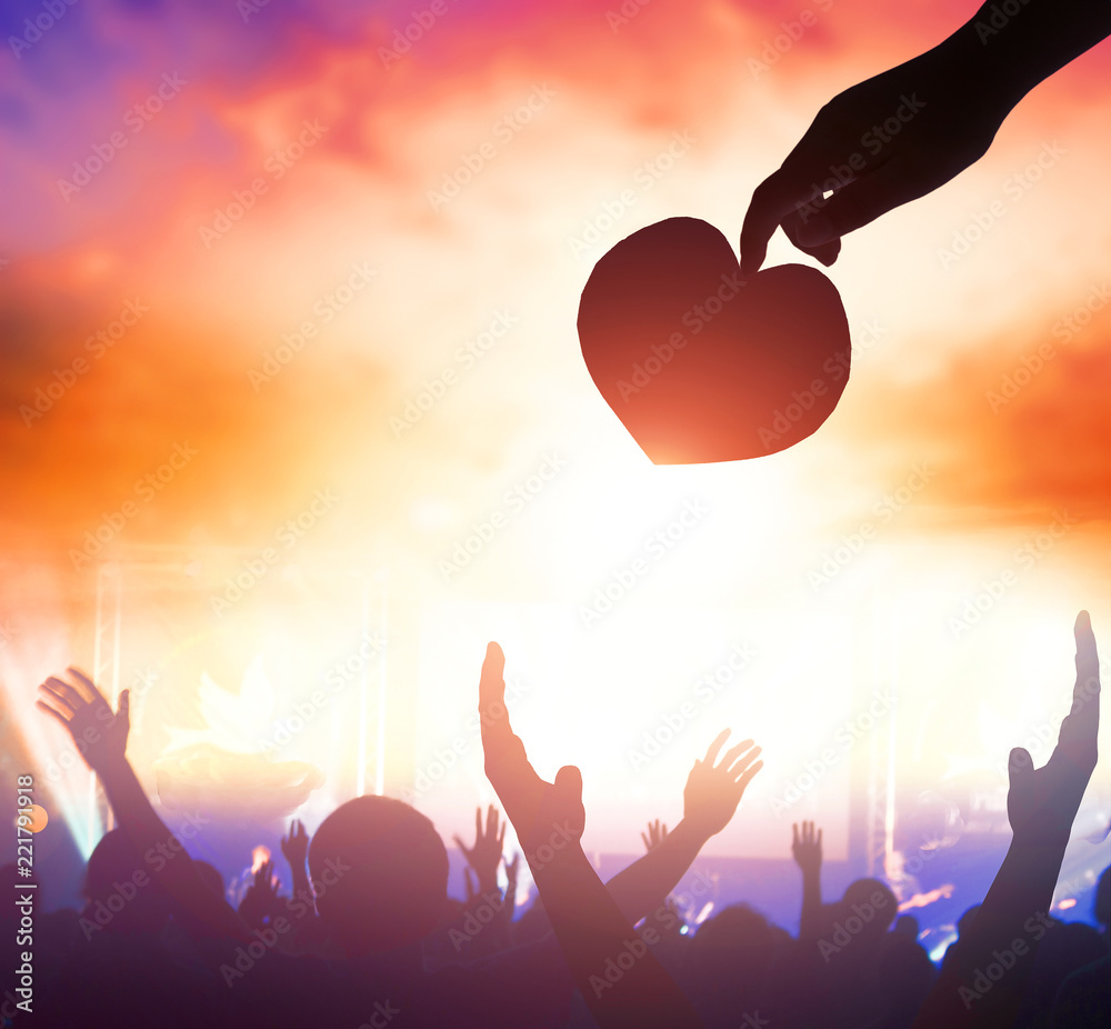 Poster international day of peace:silhouette of man raised hands at autumn sunset meadow background