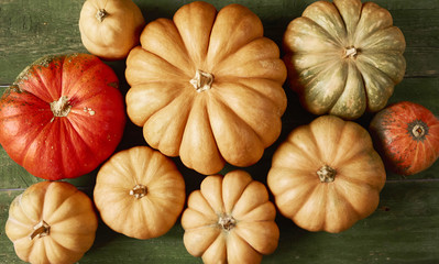 A lot of pumpkin on rustic background. Top view