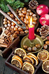 Red winter apples with nuts and fir-tree branches. Christmas or New Year concept