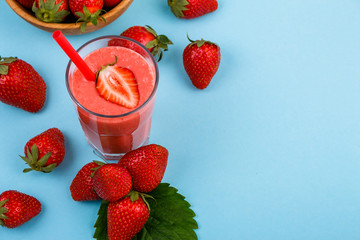 fresh strawberrysmoothie or milkshake on a delicately blue background