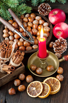Christmas composition with apples, hazelnuts and spices