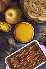 Autumn background. Homemade Pumpkin, apple Pies for Thanksgiving Ready to Eat.