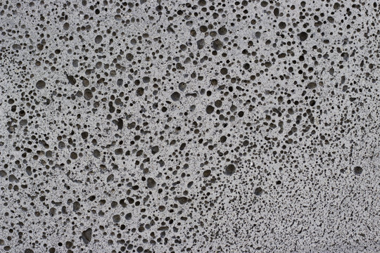 dark gray foam concrete close-up, texture, background, material with copy space.