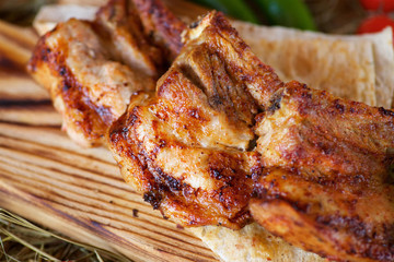 Three pieces of fried meat on pita bread
