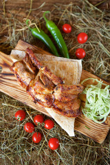 Three pieces of fried meat on pita bread