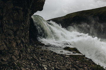 steam above mountain river flowing through highlands in Iceland