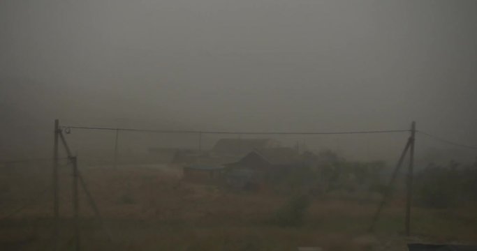 Strong hurricane Downpour with hail Zero visibility in bad weather over the village
