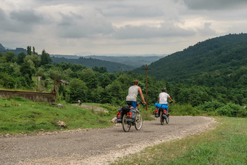 Bicyclists on the rural road in Abkhazia