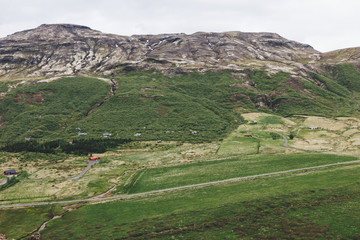 aerial view of landscape with houses and mountains range in Iceland