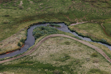 aerial view of beautiful river flowing through highlands in Iceland