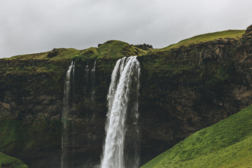 scenic view of landscape with Seljalandsfoss waterfall in highlands in Iceland