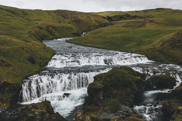 landscape with beautiful Skoga river flowing through highlands in Iceland