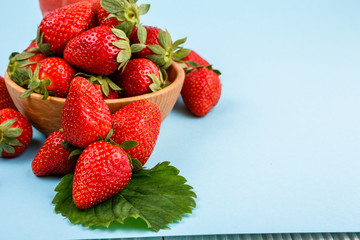 juicy fresh strawberry on a delicately blue background
