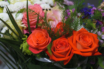 bouquet with red orange roses and other flowers