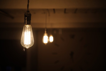 Lamps with tungsten filament. Edison's light bulb. Filament filament in vintage lamps. Retro design of light bulbs.