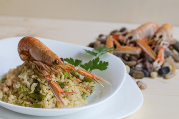 Escapes and risotto with asparagus and escapes on white background close-up