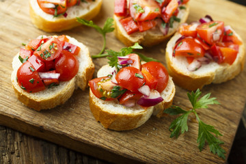 Tomato bruschetta with red onion and parsley