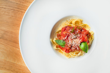 tagliatelle macaroni with cheese, basil and tomato sauce