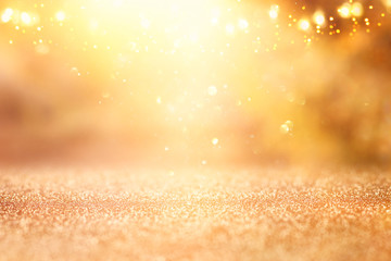 glitter vintage lights background. silver and gold. de-focused.