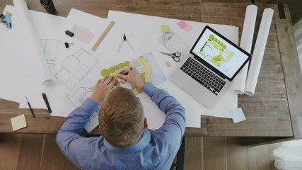 Top view of landscape architect designing backyard plan for villa