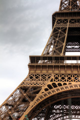 Beautiful detail shot of the Eiffel tower in Paris, France, on a cloudy winter day
