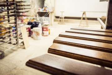 Wooden planks. Painting and varnishing workshop