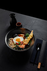 high angle view of delicious traditional japanese soup in bowl with chopsticks and spoon