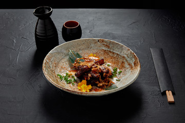 delicious traditional japanese meal on plate and chopsticks