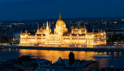 Hungarian Parliament in Budapest reflected in Danube river